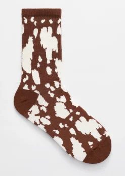 Socken mit Kuhmuster