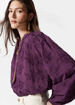 Voluminöse Bluse mit Blumenapplikation