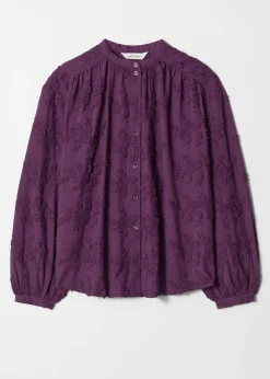 Voluminöse Bluse mit Blumenapplikation