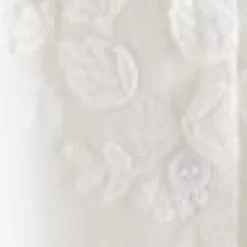 Voluminöse Bluse mit Blumenapplikation