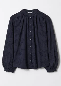 Voluminöse Bluse mit Blumenapplikation